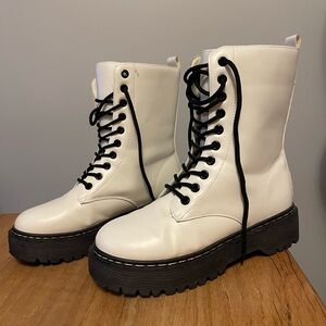 White lace up boots with black sole